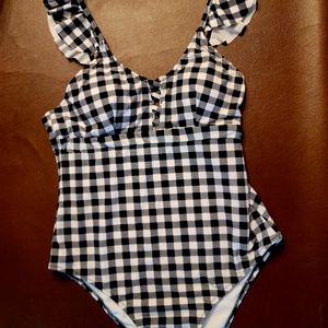 One piece bathing suit size Large.
